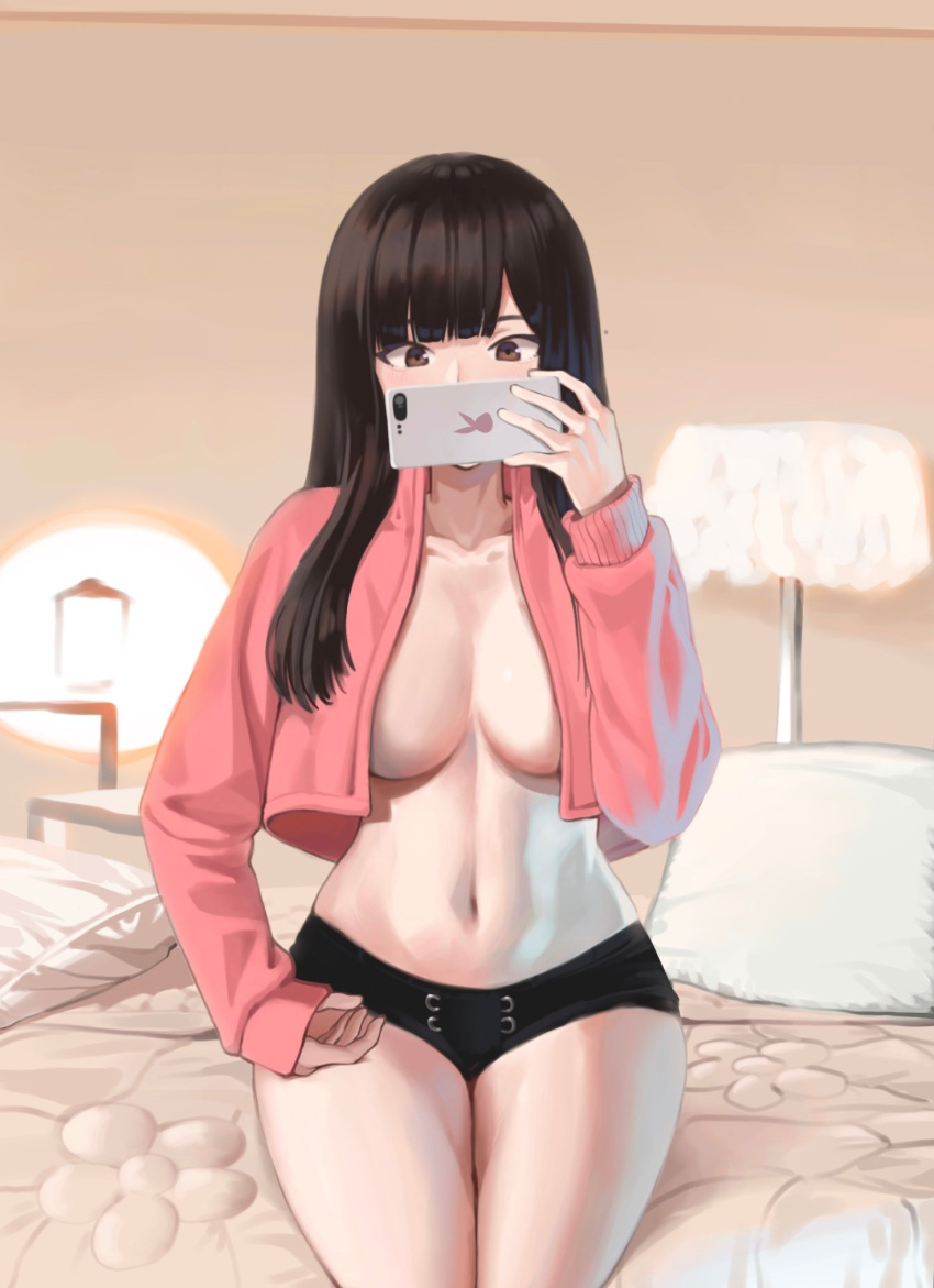 1girl black_hair black_shorts breasts brown_eyes cellphone cleavage collarbone covering_mouth crop_top crop_top_overhang cropped_jacket hand_up highres holding holding_phone jacket lampshade large_breasts long_hair long_sleeves looking_at_viewer micro_shorts navel no_bra open_clothes open_jacket original phone pillow pink_jacket shorts sitting smartphone solo stomach thighs yareen