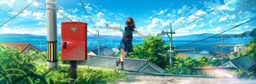 1girl absurdres blue_sailor_collar blue_skirt brown_hair day hayateluc highres kneehighs lake loafers mailbox_(incoming_mail) medium_hair mountain mountainous_horizon original outdoors outstretched_arms pleated_skirt power_lines sailor_collar school_uniform shirt shoes skirt socks solo town utility_pole walking water white_shirt