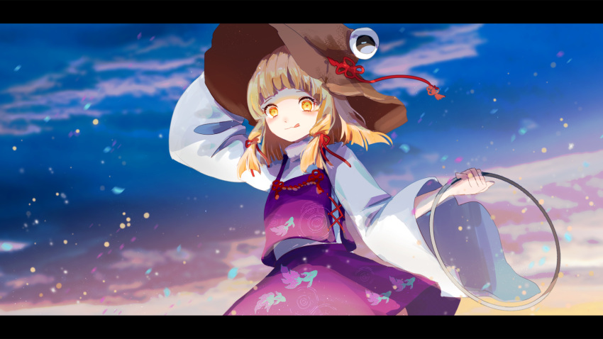 1girl :3 :q animal_print bangs blonde_hair blue_sky blunt_bangs blush cake_mogo closed_mouth cloud commentary cowboy_shot fish_print gradient_sky hand_on_headwear highres holding letterboxed long_sleeves looking_at_viewer medium_hair moriya's_iron_rings moriya_suwako outdoors purple_skirt purple_vest shirt skirt sky smile solo symbol-only_commentary tongue tongue_out touhou turtleneck vest white_shirt wide_sleeves yellow_eyes yellow_sky