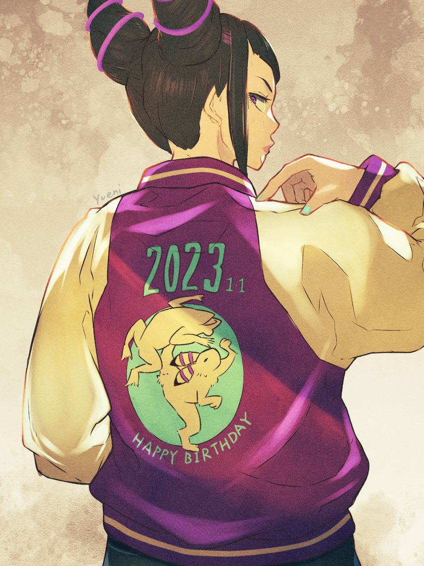 1girl 2023 animal_print black_hair clothes_writing commentary_request cone_hair_bun drill_hair english_text frog_print from_behind hair_bun hair_horns han_juri happy_birthday highres jacket letterman_jacket looking_at_viewer looking_back rabbit_print signature street_fighter street_fighter_iv_(series) sukajan twin_drills yuenibushi
