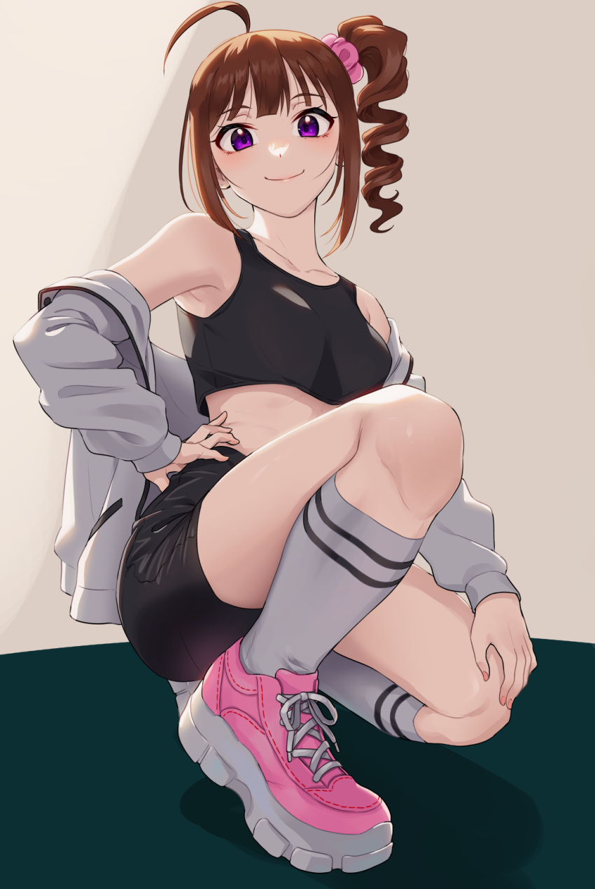 1girl ahoge armpits black_shorts black_sports_bra blush breasts brown_hair collarbone drill_hair fingernails full_body grey_jacket hair_ornament hair_scrunchie hand_on_hip hand_on_own_knee highres idolmaster idolmaster_million_live! jacket jacket_partially_removed kamille_(vcx68) looking_at_viewer nail_polish one_knee pink_footwear purple_eyes scrunchie shoes shorts side_ponytail small_breasts smile sneakers socks sports_bra white_socks yokoyama_nao
