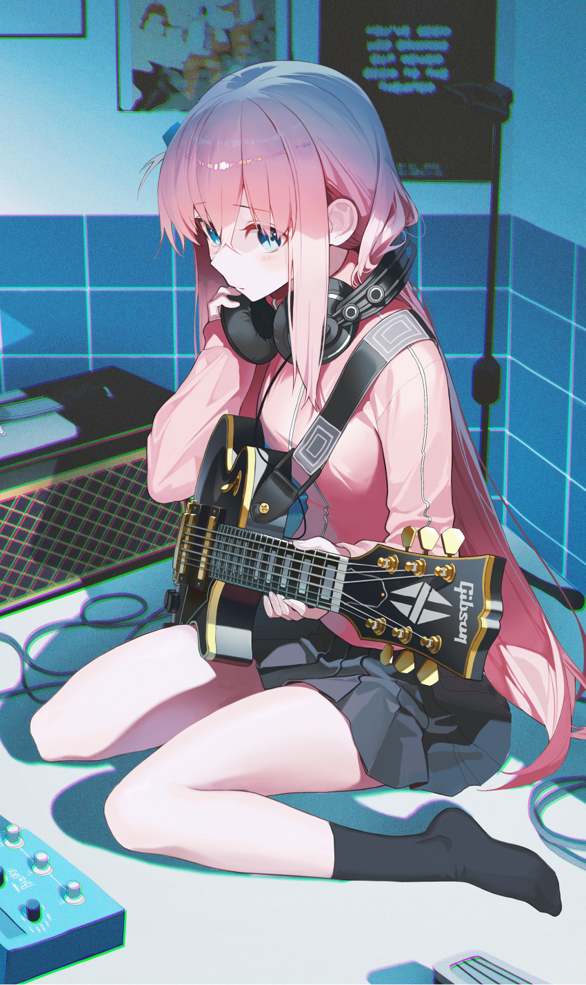 1girl absurdres bangs black_skirt black_socks blue_eyes bocchi_the_rock! breasts closed_mouth commentary dutch_angle electric_guitar gibson_les_paul gotou_hitori guitar hair_between_eyes hair_over_eyes headphones headphones_around_neck highres holding holding_headphones holding_instrument indoors instrument jacket light_blush long_hair long_sleeves looking_at_viewer no_shoes pink_hair pink_jacket pleated_skirt pro-p sitting skirt small_breasts socks solo standing track_jacket wariza
