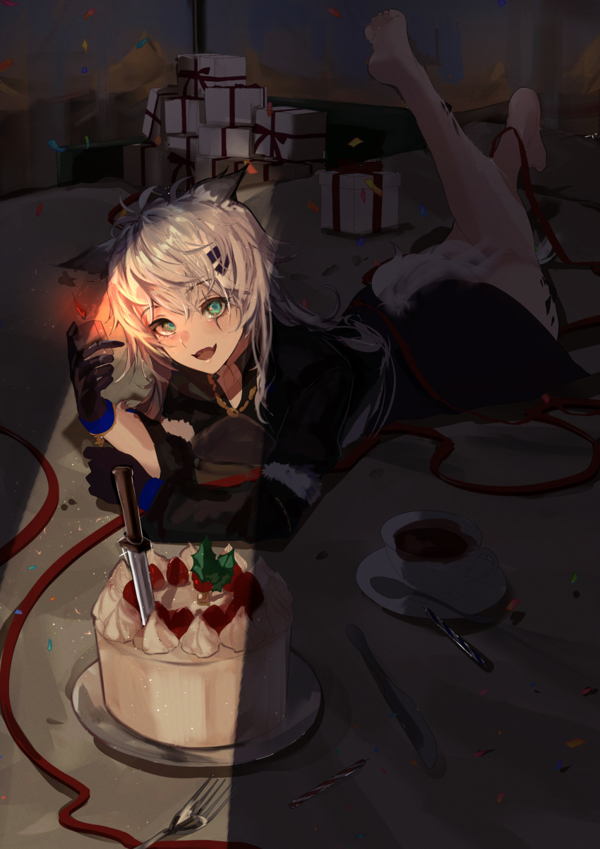 1girl :d animal_ears arknights barefoot black_gloves black_jacket blue_eyes box cake commentary_request cup fang fire food gift gift_box gloves highres holding jacket knife lappland_(arknights) leg_up lighter long_sleeves looking_at_viewer lying maria_(syake-uni) on_stomach saucer smile soles solo spoon tail tea teacup the_pose