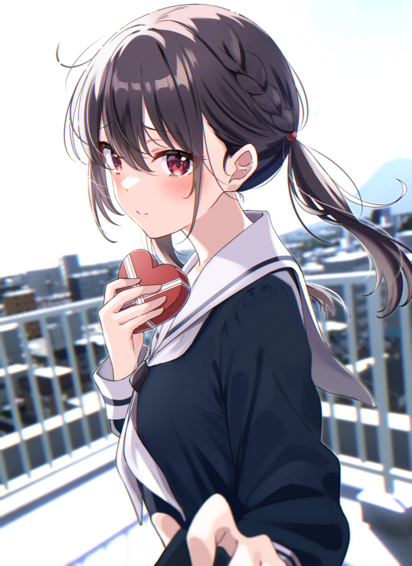 1girl black_hair black_serafuku blurry blurry_background blush box braid building city day hair_between_eyes hand_up heart-shaped_box highres holding holding_box long_sleeves looking_at_viewer neckerchief original pov railing red_eyes rooftop sailor_collar school_uniform serafuku shiokazunoko single_braid smile uniform upper_body valentine white_neckerchief white_sailor_collar