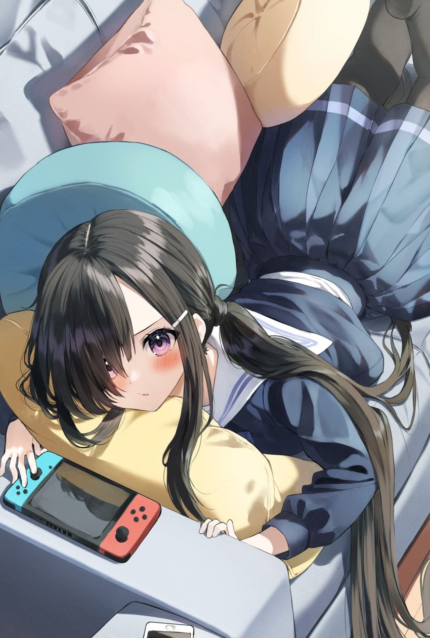 1girl bangs black_hair black_pantyhose blue_serafuku blue_shirt blue_skirt blush cellphone commentary_request couch hair_ornament hair_over_one_eye hairclip highres indoors long_hair long_sleeves looking_at_viewer low_twintails lying nintendo_switch on_couch on_stomach original pantyhose parted_lips pentagon_(railgun_ky1206) phone pillow pleated_skirt puffy_long_sleeves puffy_sleeves purple_eyes sailor_collar school_uniform serafuku shirt skirt solo twintails very_long_hair white_sailor_collar