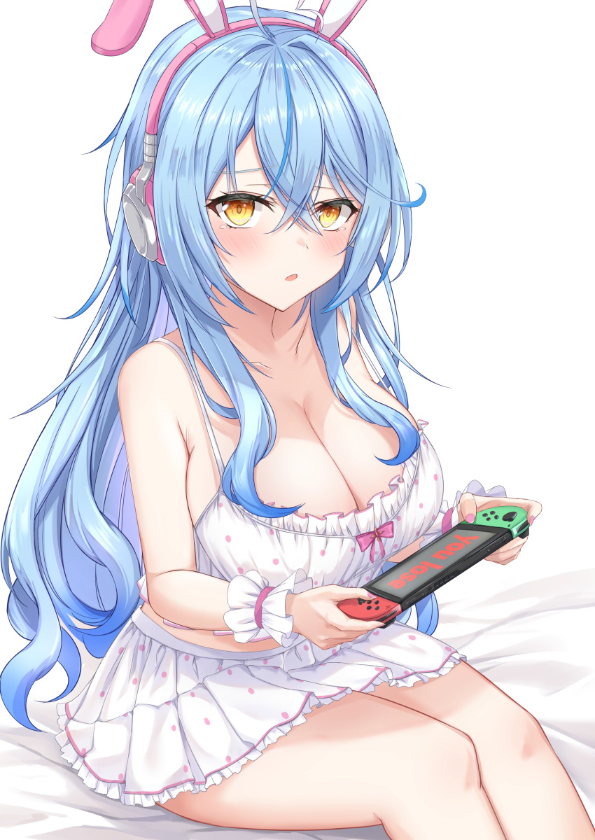 1girl :o absurdres animal_ears bare_shoulders bed_sheet blue_hair blush breasts camisole cleavage english_text fake_animal_ears frills handheld_game_console headphones heckler_kai highres holding hololive large_breasts long_hair looking_at_viewer miniskirt multicolored_hair nintendo_switch on_bed open_mouth playing_games polka_dot polka_dot_camisole polka_dot_skirt rabbit_ears sitting skirt solo streaked_hair tears two-tone_hair very_long_hair virtual_youtuber wrist_cuffs yellow_eyes yukihana_lamy