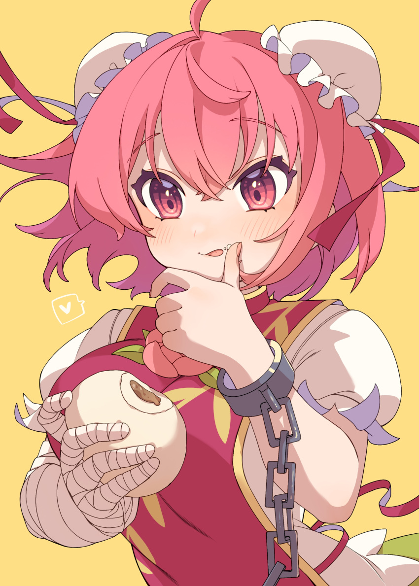 1girl absurdres ahoge bandaged_arm bandages baozi blush bun_cover chain cuffs e_sdss fingernails food food_on_face hair_between_eyes highres holding holding_food ibaraki_kasen pink_eyes pink_hair shirt short_hair short_sleeves simple_background solo tabard tongue tongue_out touhou upper_body white_shirt yellow_background