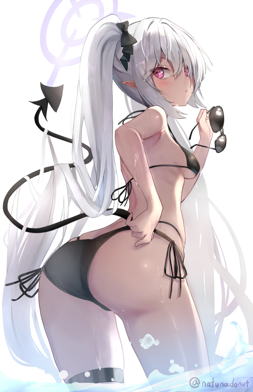 1girl ass bare_arms bare_legs bare_shoulders bikini black_bikini black_tail blue_archive blush breasts commentary_request cowboy_shot dark-skinned_female dark_skin demon_tail grey_hair hair_between_eyes halo highres holding holding_removed_eyewear iori_(blue_archive) iori_(swimsuit)_(blue_archive) long_hair natuna_natu official_alternate_costume parted_lips purple_halo red_eyes side-tie_bikini_bottom small_breasts solo sunglasses swimsuit tail twintails twitter_username unworn_eyewear water