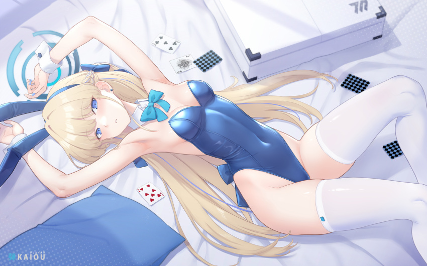 1girl animal_ears armpits arms_up bare_shoulders bed blonde_hair blue_archive blue_eyes blue_leotard blush bow bowtie braid breasts briefcase card dan_(kumadan) detached_collar fake_animal_ears fake_tail french_braid halo highleg highleg_leotard highres leotard long_hair looking_at_viewer on_bed pillow playboy_bunny playing_card rabbit_ears rabbit_tail small_breasts solo tail thighhighs thighs toki_(blue_archive) toki_(bunny)_(blue_archive) white_thighhighs wrist_cuffs