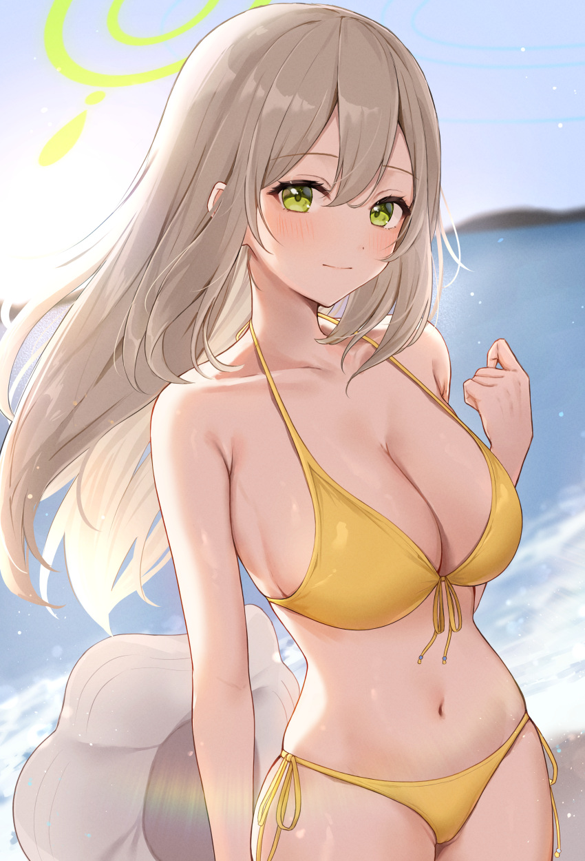 1girl absurdres bikini blonde_hair blue_archive blue_sky blush breasts cleavage closed_mouth collarbone commentary green_eyes halo halterneck hand_up hat hat_removed headwear_removed highres holding holding_clothes holding_hat honome_sui large_breasts long_hair looking_at_viewer navel nonomi_(blue_archive) nonomi_(swimsuit)_(blue_archive) ocean official_alternate_costume revision side-tie_bikini_bottom sideboob sky solo stomach string_bikini sun_hat swimsuit yellow_bikini