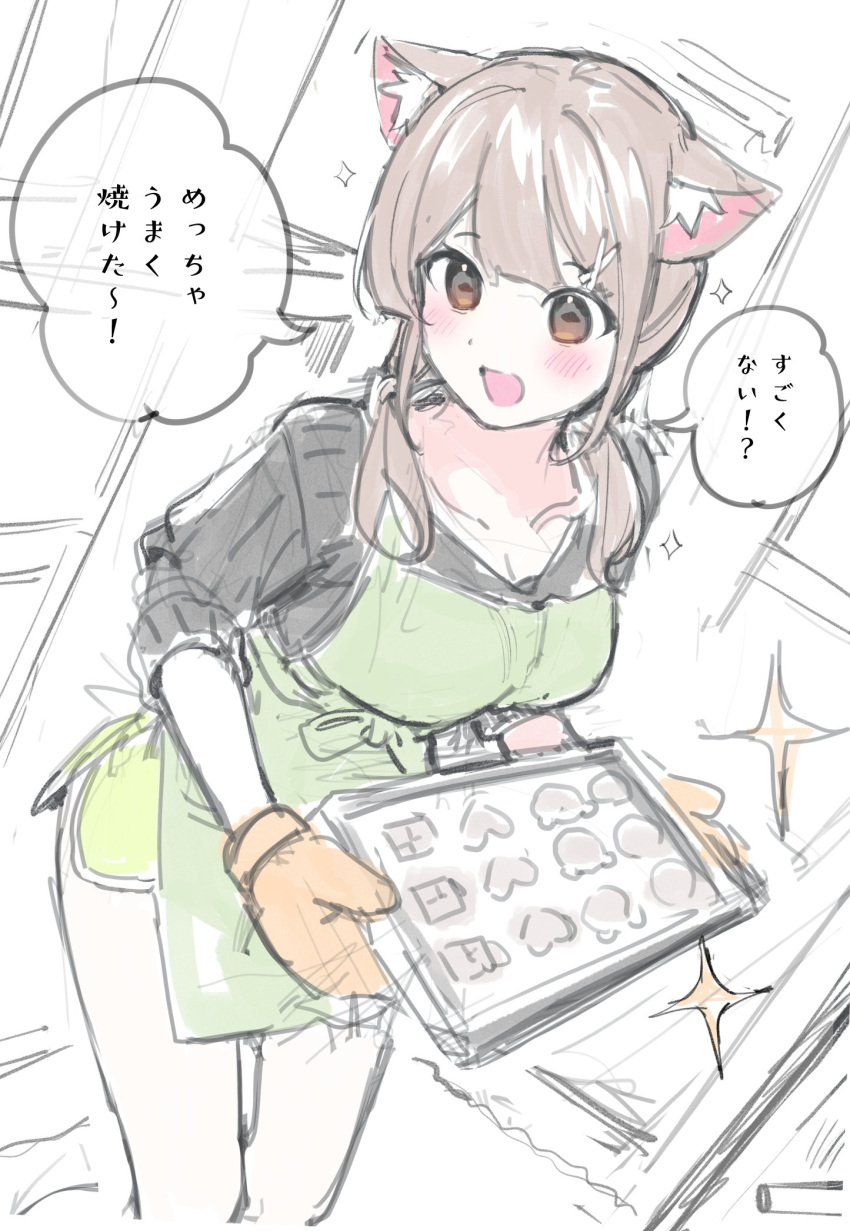 1girl :d animal_ear_fluff animal_ears apron black_shirt blush breasts brown_eyes brown_hair cat_ears chikuwa. cleavage collarbone commentary_request green_apron green_shorts hair_ornament hairclip highres holding indoors long_hair long_sleeves medium_breasts original oven_mitts shirt short_shorts shorts sketch smile solo sparkle translation_request