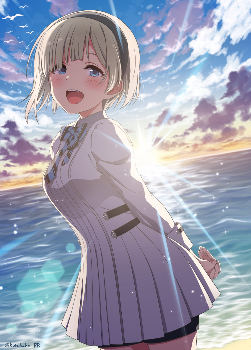 1girl absurdres arms_behind_back beach bike_shorts bird black_hairband blonde_hair blue_bow blue_eyes blue_sky blush bow breasts cloud cowboy_shot dot_nose dress from_side hair_over_one_eye hairband highres idolmaster idolmaster_starlit_season kurobako_bb large_breasts lens_flare long_sleeves looking_at_viewer ocean okuzora_kohaku open_mouth outdoors seagull short_hair sky smile solo standing striped striped_bow sunlight sunrise teeth twitter_username upper_teeth_only white_dress