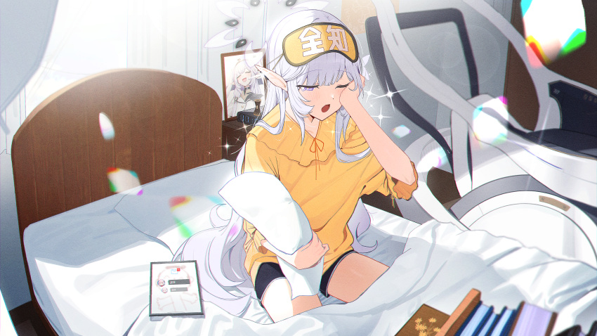 1girl ;o absurdres alternate_costume bed_frame bed_sheet black_shorts blanket blue_archive blush book dolphin_shorts grey_hair halo highres himari_(blue_archive) indoors on_bed one_eye_closed photo_(object) picture_frame pillow pointy_ears purple_eyes shirt shorts sleepy solo tablet_pc tears waking_up wheelchair yellow_shirt zanya_000