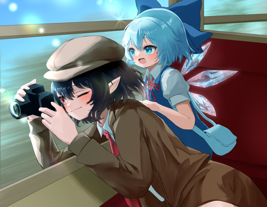 2girls black_hair blue_bow blue_dress blue_hair bow brown_coat brown_headwear camera cirno coat collared_shirt dress fairy hair_bow hat highres holding holding_camera ice ice_wings long_sleeves mikan_(manmarumikan) multiple_girls necktie pointy_ears red_necktie shameimaru_aya shameimaru_aya_(newsboy) shirt short_hair short_sleeves touhou white_shirt wings