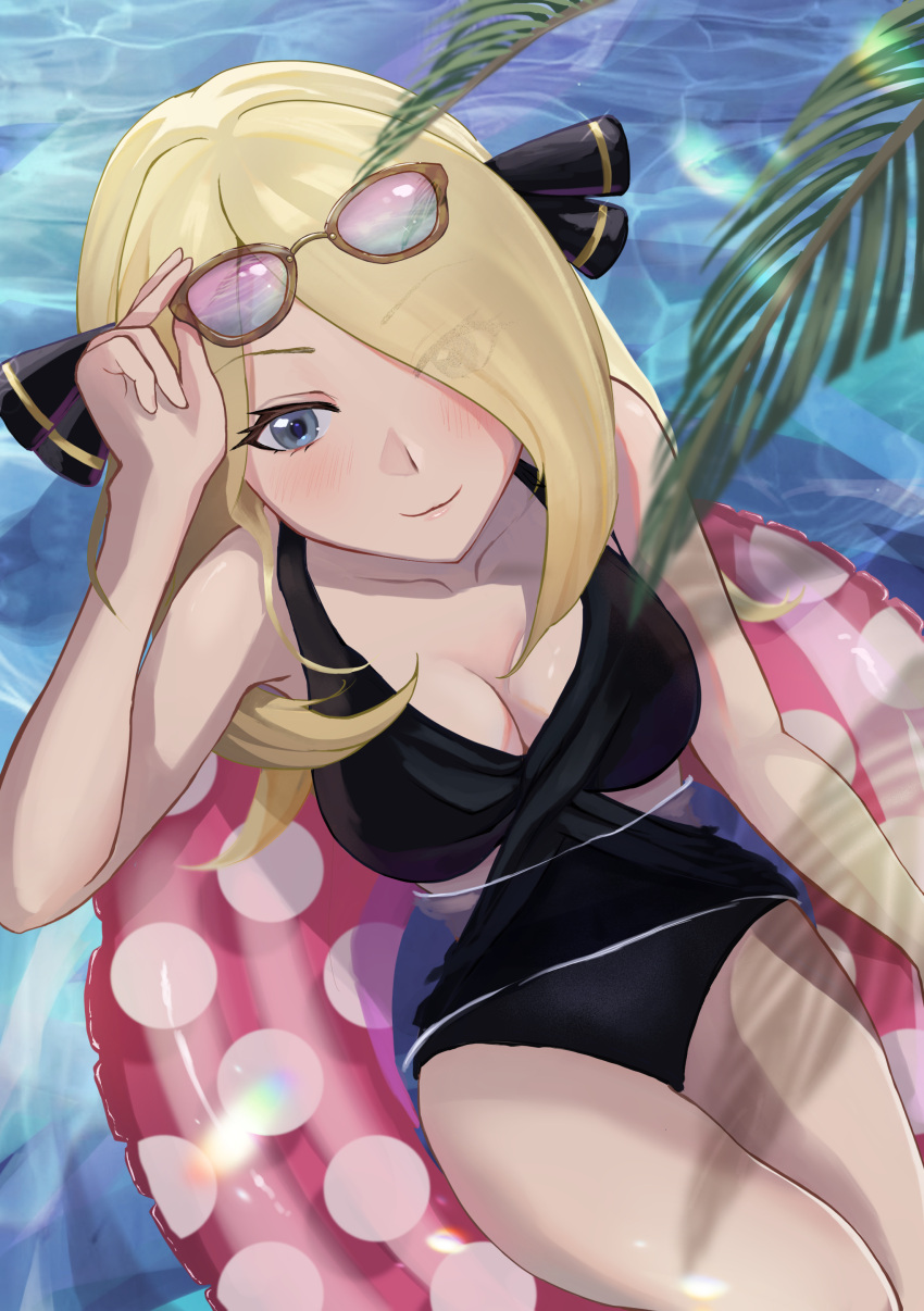 1girl absurdres afloat alternate_costume arm_up black_one-piece_swimsuit blonde_hair blurry blurry_foreground blush breasts cleavage closed_mouth collarbone commentary_request cynthia_(pokemon) day eyelashes eyewear_on_head grey_eyes hair_ornament hair_over_one_eye highres innertube leaf long_hair manta_shinkai medium_breasts one-piece_swimsuit outdoors pokemon pokemon_(game) pokemon_dppt polka_dot_innertube smile solo sunglasses swimsuit water