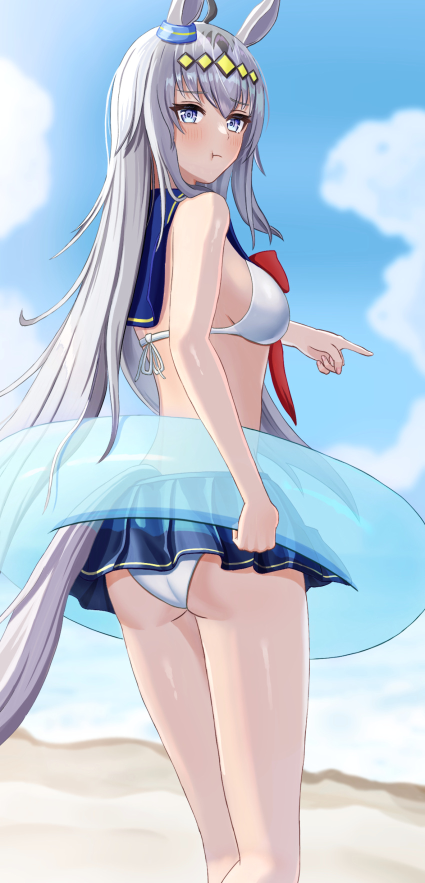 1girl absurdres adapted_costume ahoge animal_ears ass beach bikini bikini_skirt blue_innertube blue_sky blurry blurry_background blush breasts closed_mouth cloud cloudy_sky commentary_request ear_ornament feet_out_of_frame fuji_noriho grey_eyes grey_hair hair_between_eyes hair_ornament highres horse_ears horse_girl horse_tail long_hair looking_at_viewer medium_breasts multicolored_hair neckerchief ocean oguri_cap_(umamusume) outdoors pointing pout red_neckerchief sailor_collar sand sky solo streaked_hair swimsuit tail umamusume very_long_hair water white_bikini