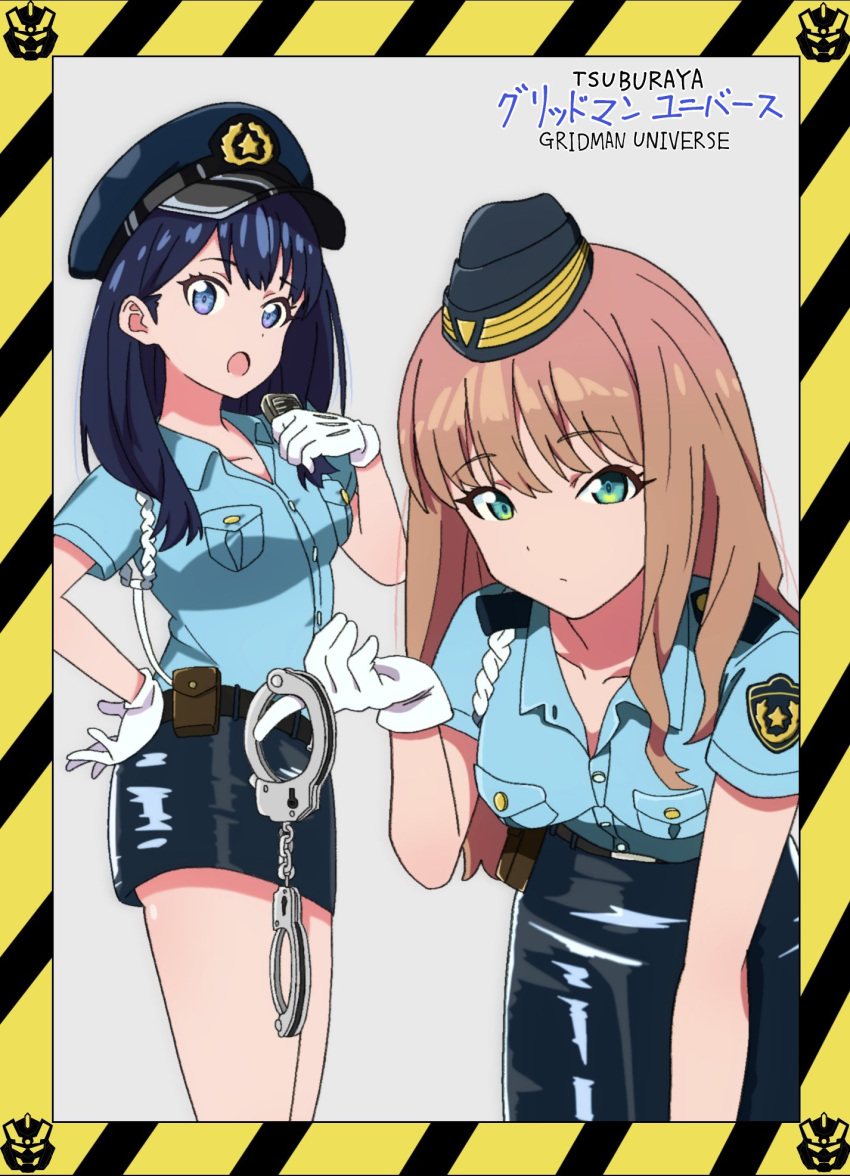 2girls black_hair black_skirt blue_eyes blue_shirt border brown_hair collared_shirt copyright_name cuffs gloves green_eyes grey_background gridman_universe hand_on_own_hip handcuffs hat highres holding holding_handcuffs holding_walkie-talkie leaning_forward long_hair looking_at_viewer minami_yume multiple_girls open_mouth pencil_skirt police police_hat police_uniform policewoman shirt skirt sn1995sho ssss.dynazenon ssss.gridman takarada_rikka uniform walkie-talkie white_gloves