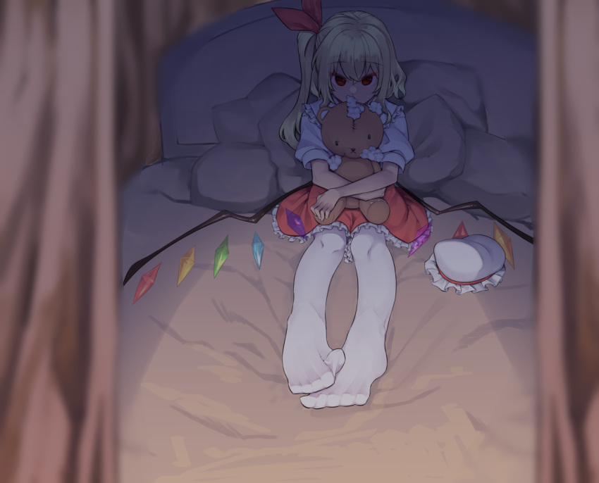 1girl bed blonde_hair blurry blurry_foreground collared_shirt covered_mouth crossed_arms crossed_bangs crystal curtains damaged dark dark_background depth_of_field dorsiflexion empty_eyes feet flandre_scarlet foot_focus foreshortening frilled_shirt_collar frills full_body hair_between_eyes hair_ribbon hat hat_removed headwear_removed holding holding_stuffed_toy indoors long_hair looking_at_viewer low_wings mob_cap no_shoes object_hug on_bed outstretched_legs pantyhose petticoat pillow puffy_short_sleeves puffy_sleeves red_eyes red_ribbon red_skirt ribbon shamo_(koumakantv) shirt short_sleeves side_ponytail sidelocks sitting skirt solo straight-on stuffed_animal stuffed_toy stuffing teddy_bear toes torn touhou white_headwear white_pantyhose white_shirt wing_collar wings