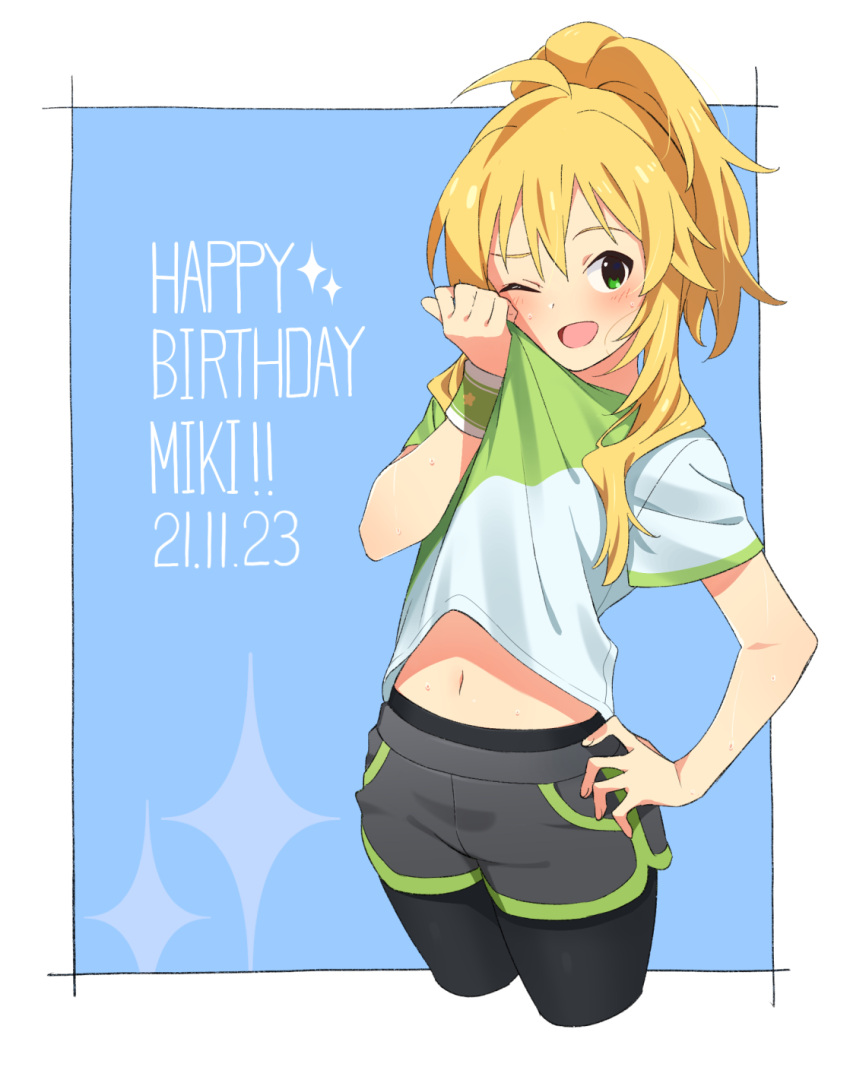 1girl black_leggings blonde_hair blue_background blush border clothes_lift dated green_eyes green_shirt grey_shorts gulim hand_on_own_hip hand_up happy_birthday highres hoshii_miki idolmaster idolmaster_(classic) leggings long_hair midriff_peek navel one_eye_closed open_mouth outside_border ponytail shirt shirt_lift short_shorts shorts sidelocks solo sparkle sweat two-tone_shirt white_border white_shirt wiping_face wiping_sweat wristband