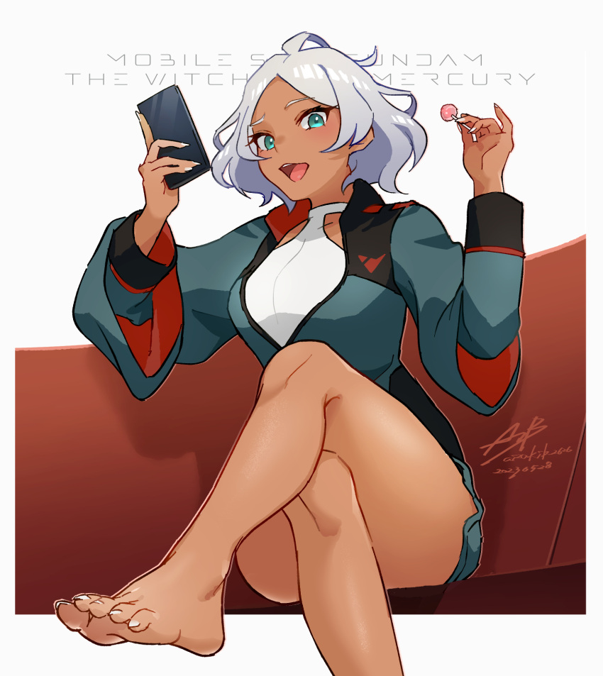 1girl ahoge aizaki_b asticassia_school_uniform barefoot blue_eyes candy cellphone commentary copyright_name crossed_legs dark-skinned_female dark_skin english_text feet food foot_focus green_jacket grey_hair gundam gundam_suisei_no_majo highres holding holding_candy holding_food holding_lollipop holding_phone jacket lollipop phone school_uniform secelia_dote smartphone solo_focus thighs