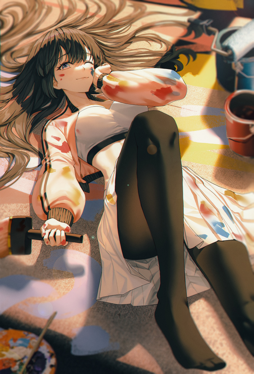 1girl absurdres bangs black_hair black_pantyhose blue_eyes blurry breasts convenient_leg crop_top depth_of_field gradient_background hair_spread_out highres holding holding_paintbrush jacket jisu_lee legs long_hair looking_at_viewer lying medium_breasts midriff no_shoes one_eye_closed open_clothes open_jacket original paint_on_clothes paint_splatter paint_splatter_on_face paintbrush pantyhose pink_jacket pleated_skirt shirt skirt smile white_shirt white_skirt