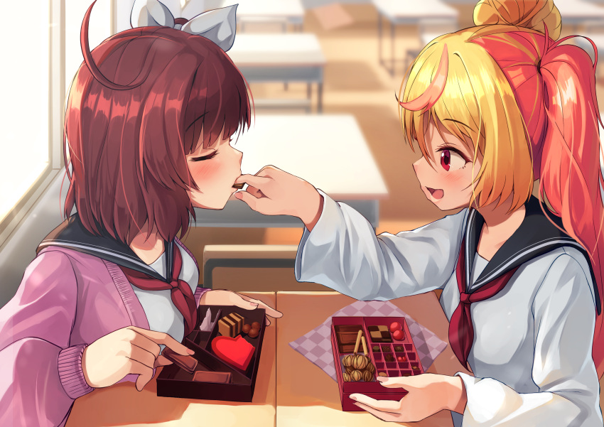 2girls absurdres ahoge black_sailor_collar blonde_hair blush bow breasts candy cardigan chocolate classroom closed_eyes desk feeding finger_in_another's_mouth food hair_bow heart heart-shaped_chocolate highres large_breasts looking_at_another medium_hair multicolored_hair multiple_girls original pink_hair ponytail purple_cardigan red_eyes red_hair sailor_collar school_desk school_uniform shared_food shirt smile uniform valentine wanashi_tam white_bow white_shirt yuri