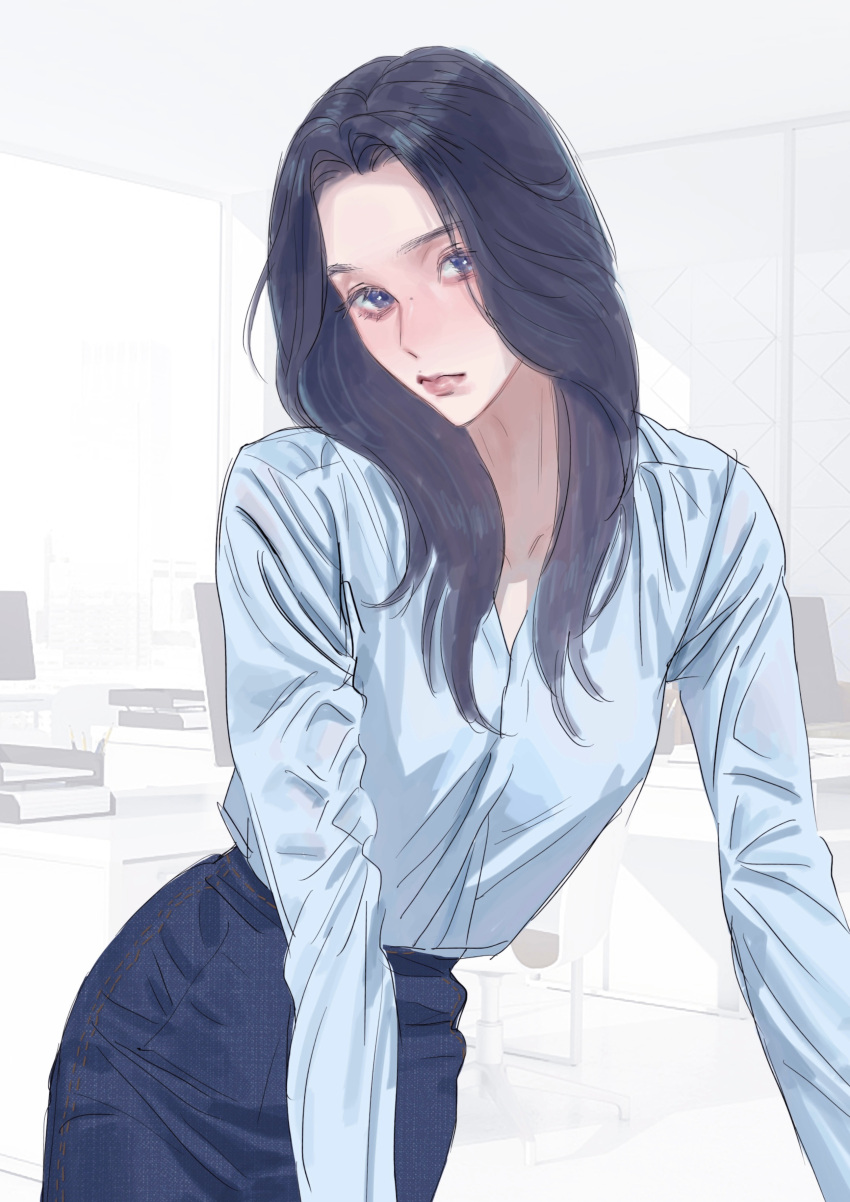 1girl absurdres black_hair blue_eyes blue_skirt blush head_tilt highres indoors jiangkang_meizi k-pop leaning_forward long_hair looking_at_viewer mina_(twice) mole mole_on_nose office office_lady pencil_skirt real_life shirt_tucked_in skirt solo twice_(group)