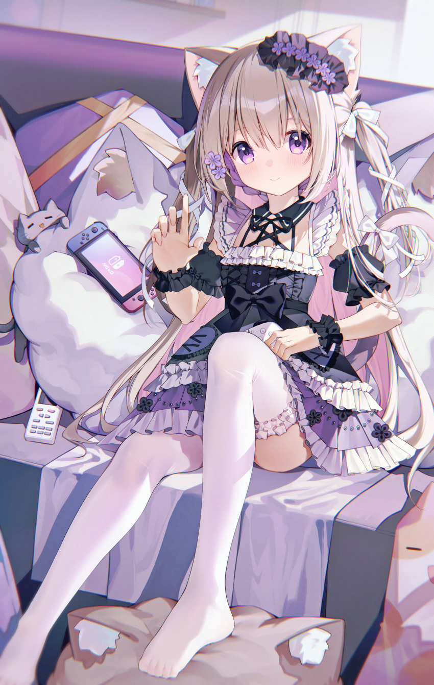 1girl absurdres animal_ear_fluff animal_ears black_bow black_dress bow cat_ears cat_girl cat_tail commentary_request controller couch detached_sleeves dress hair_ornament highres light_brown_hair nintendo_switch on_couch original pillow purple_eyes ratto_(ratto_channel) remote_control sitting tail thighhighs white_thighhighs wrist_cuffs