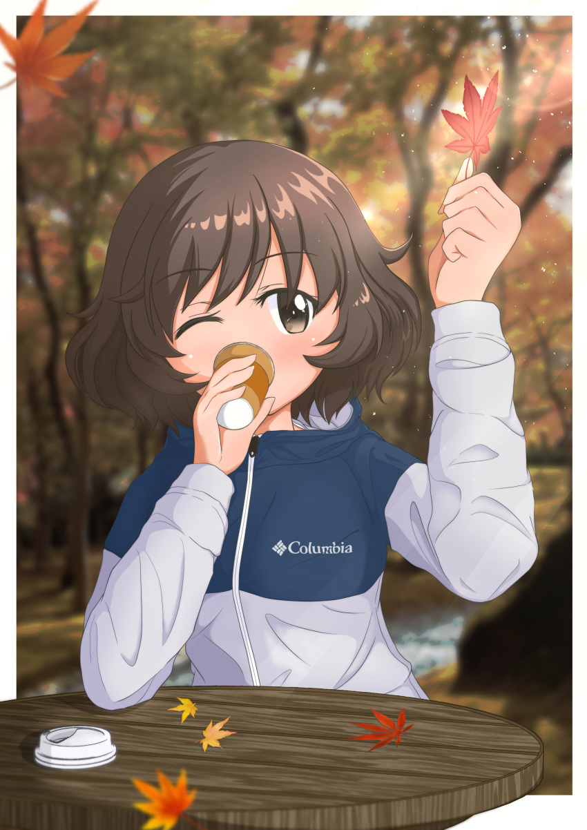 absurdres akiyama_yukari autumn blush border brown_eyes brown_hair coffee colombia cup drinking girls_und_panzer highres holding holding_cup holding_leaf jacket leaf maikaooba maple_leaf one_eye_closed photo_background short_hair table track_jacket white_border wooden_table