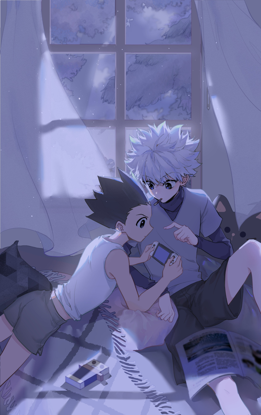 2boys absurdres black_hair black_shorts blue_eyes blue_sweater brown_eyes commentary curtains food_in_mouth gon_freecss grey_shirt grey_shorts highres hunter_x_hunter indoors killua_zoldyck layered_shirt layered_sleeves long_sleeves lying maosishu midriff multiple_boys newspaper night nintendo_switch on_stomach pillow playing_games pocky_in_mouth pointing pointing_at_another shirt shirt_rolled_up short_over_long_sleeves short_sleeves shorts sitting sleeveless sleeveless_shirt spiked_hair sweater t-shirt tank_top toy turtleneck v-shaped_eyebrows white_hair white_shirt window yaoi