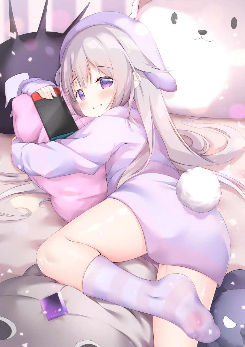 1girl absurdres animal_ears ass blush brown_hair commentary english_commentary fake_animal_ears fake_tail grin highres holding hololive hololive_english jacket koseki_bijou long_hair lying nintendo_switch no_shoes on_side pillow purple_eyes rabbit_ears rabbit_tail renew_vivi smile socks soles solo striped striped_jacket striped_socks tail very_long_hair virtual_youtuber