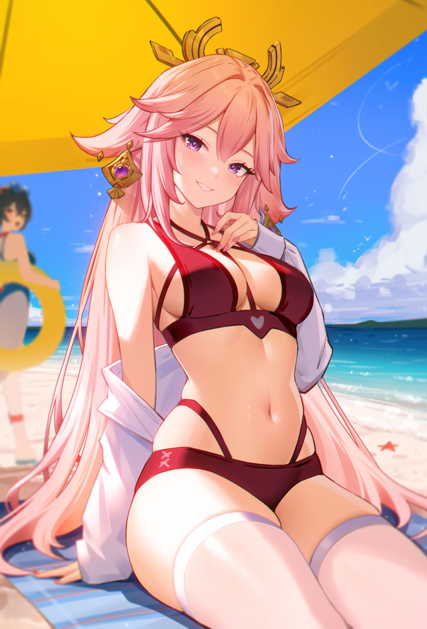 2girls 95--- animal_ears bare_shoulders beach_towel bikini blurry blurry_background breasts commentary fox_ears genshin_impact grin highres long_hair looking_at_viewer multiple_girls navel pink_hair purple_eyes red_bikini sitting smile stomach swimsuit thighhighs thighs towel very_long_hair white_thighhighs yae_miko