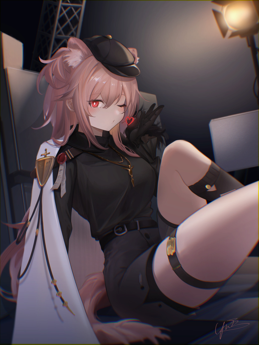1girl absurdres animal_ears arknights black_gloves black_headwear black_shirt black_shorts black_socks blush breasts bright_pupils cape extra_ears gloves gravel_(arknights) hat heart highres indoors jewelry knee_up long_hair looking_at_viewer medium_breasts necklace one_eye_closed pink_hair red_eyes shirt shirt_tucked_in shorts sitting socks solo stage_lights tail thighs white_cape white_pupils yunnasu