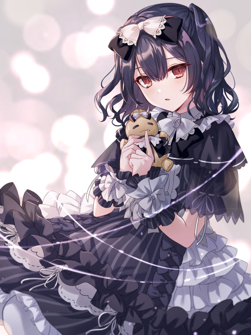 1girl black_dress black_hair black_ribbon blush bow doll dress frills gothic_lolita hair_between_eyes hair_ornament highres holding holding_doll idolmaster idolmaster_shiny_colors iku2727 lace layered_dress lolita_fashion looking_at_viewer morino_rinze parted_lips red_eyes ribbon scrunchie short_hair solo straw_doll