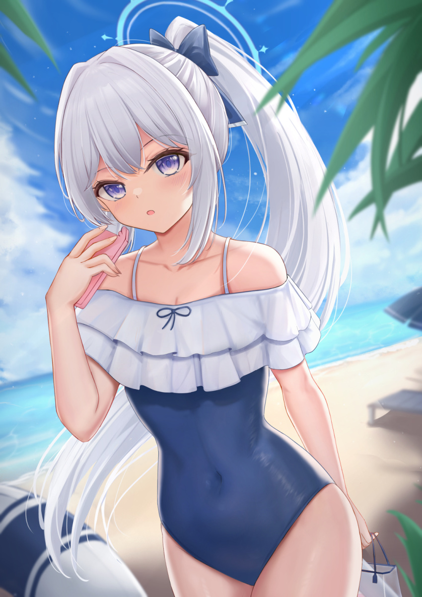 1girl bag bare_shoulders blue_archive blue_bow blue_one-piece_swimsuit blue_sky blurry blurry_background blush bow breasts cellphone cleavage cloud commentary_request covered_navel day depth_of_field frilled_one-piece_swimsuit frills grey_hair hair_bow halo hand_up highres holding holding_bag holding_phone horizon long_hair miyako_(blue_archive) miyako_(swimsuit)_(blue_archive) nezumi_(09261377) ocean off-shoulder_one-piece_swimsuit off_shoulder official_alternate_costume one-piece_swimsuit outdoors phone plastic_bag ponytail purple_eyes revision sidelocks sky small_breasts solo swimsuit transparent very_long_hair