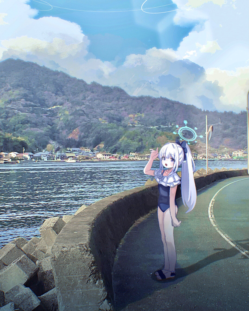 1girl arm_at_side bare_legs bay blue_archive blue_bow blue_one-piece_swimsuit blue_sky blush bow cloud cloudy_sky day frilled_one-piece_swimsuit frills guard_rail hair_bow halo hand_up highres long_hair looking_at_viewer lumi_snowfall miyako_(blue_archive) miyako_(swimsuit)_(blue_archive) mountainous_horizon one-piece_swimsuit open_mouth outdoors ponytail purple_eyes road sandals shadow sky smile solo standing swimsuit tetrapod town white_hair