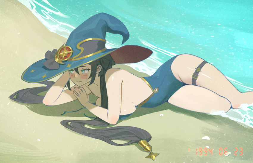 1girl bare_shoulders beach black_hair blue_headwear blue_one-piece_swimsuit blush bow breasts closed_mouth covered_navel embarrassed genshin_impact gold_trim green_eyes hat hat_bow hat_ornament highres long_hair looking_to_the_side lying medium_breasts midfinger mona_(genshin_impact) navel on_side one-piece_swimsuit outdoors ponytail_holder sand shore sideboob solo star_(symbol) sweatdrop swimsuit thigh_strap thighs twintails untied_swimsuit water wet witch_hat