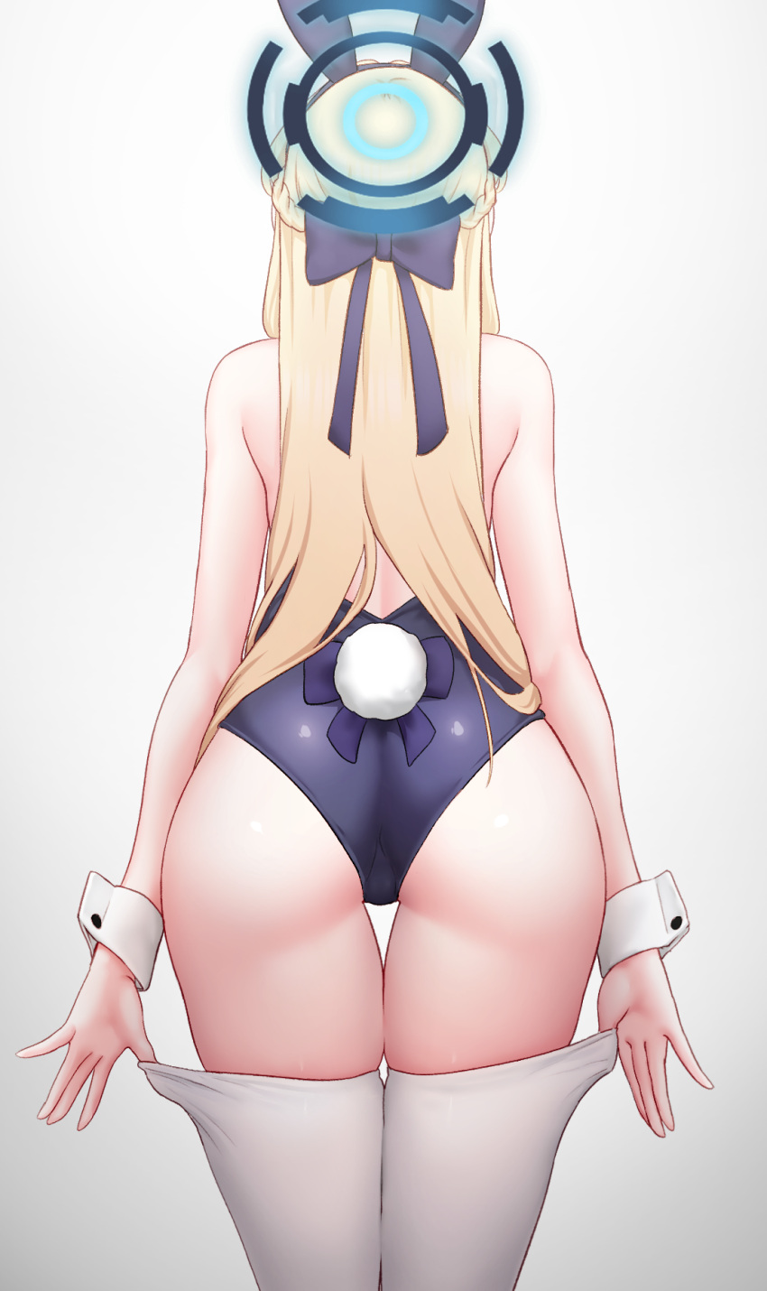 1girl animal_ears ass bare_arms bare_shoulders blonde_hair blue_archive blue_leotard bow bowtie cowboy_shot fake_animal_ears from_behind greenteamousou halo highres leaning_forward leotard long_hair official_alternate_costume playboy_bunny rabbit_ears solo strapless strapless_leotard thighhighs thighhighs_pull toki_(blue_archive) toki_(bunny)_(blue_archive) white_thighhighs wrist_cuffs
