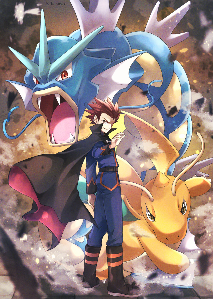 1boy black_cape black_footwear blue_jacket blue_pants boots brown_eyes cape closed_mouth dragonite full_body gyarados highres jacket lance_(pokemon) long_sleeves looking_at_viewer male_focus pants pokemon pokemon_(game) pokemon_rgby red_eyes red_hair short_hair smile spiked_hair standing yomogi_(black-elf)