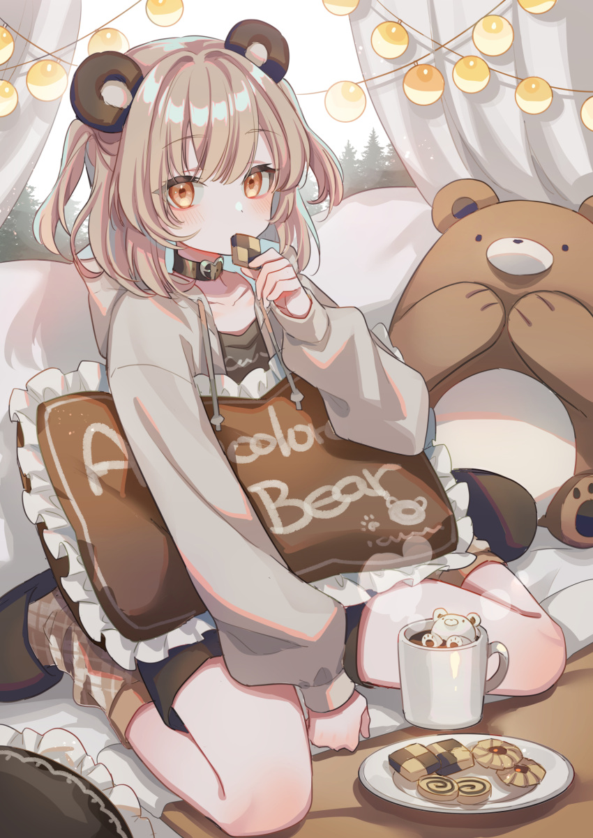 1girl absurdres animal_ears bauble bear_ears bear_girl brown_eyes brown_footwear brown_hair brown_shirt checkerboard_cookie coffee coffee_mug cookie cup curtains drawstring eating food heart_collar highres holding holding_pillow hood hood_down hoodie indoors latte_art looking_at_viewer mug on_bed original pillow plaid_socks plate shirt sitting socks solo string_of_light_bulbs stuffed_animal stuffed_toy suzaku_(zaku6584) teddy_bear thumbprint_cookie wariza window