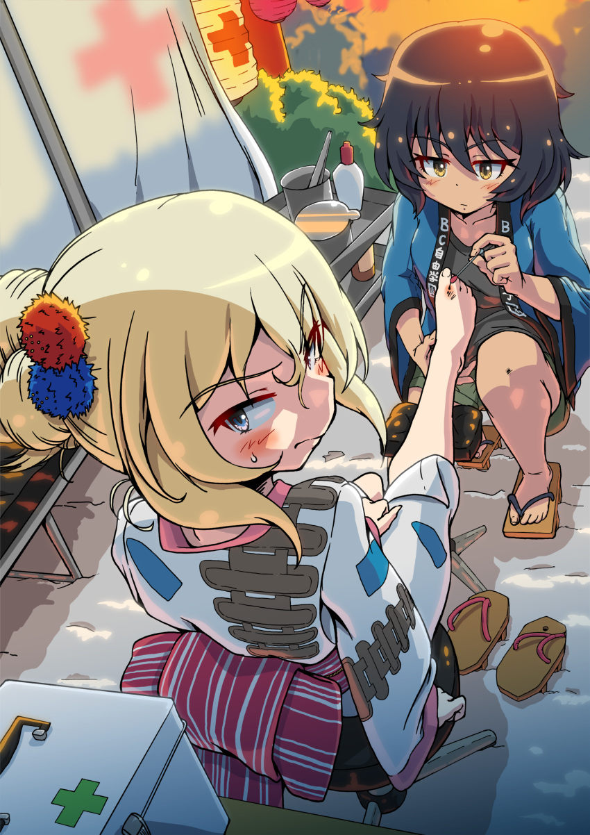 2girls absurdres alternate_hairstyle andou_(girls_und_panzer) barefoot black_hair black_shirt blonde_hair blue_jacket blue_kimono blush brown_eyes brown_footwear caterpillar_tracks closed_mouth commentary_request commission cross dark-skinned_female dark_skin first_aid first_aid_kit frown geta girls_und_panzer green_shorts hair_up hanten_(clothes) highres holding_another's_leg jacket japanese_clothes kimono kuroneko_douji lantern leg_up long_sleeves medium_hair messy_hair multiple_girls obi oshida_(girls_und_panzer) outdoors paper_lantern partial_commentary pixiv_commission red_cross sash shirt short_ponytail shorts sitting squatting summer_festival sweatdrop textless_version twilight