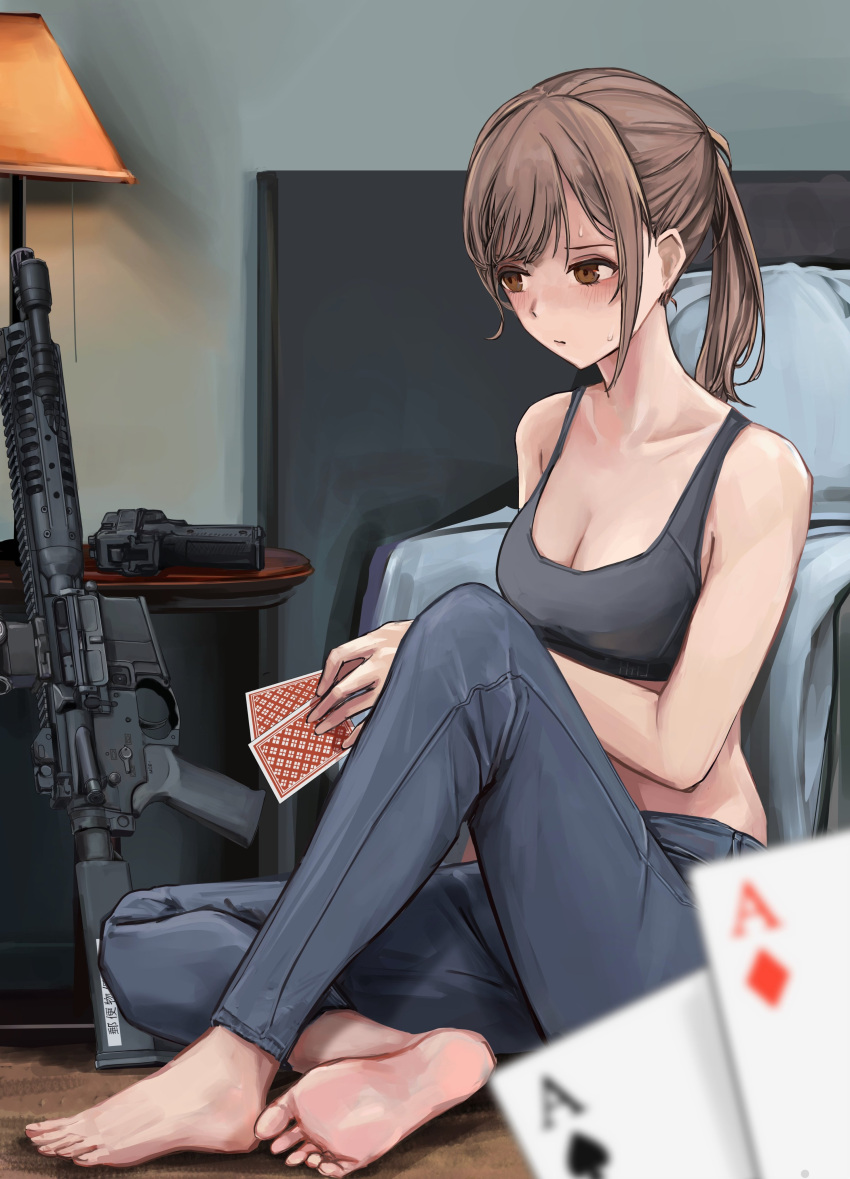 1girl 1other absurdres ace_of_clubs ace_of_diamonds assault_rifle barefoot bed blush breasts brown_eyes brown_hair card cleavage club_(shape) denim diamond_(shape) gun handgun highres holding holding_card jeans lamp lithographica original pants pillow playing_card ponytail rifle sports_bra sweat weapon