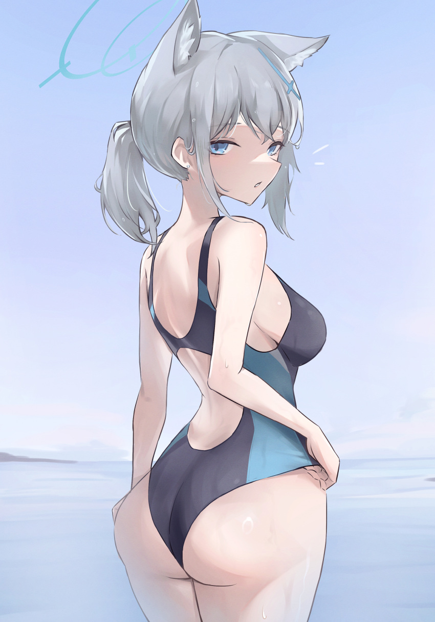 1girl absurdres animal_ear_fluff animal_ears ass black_one-piece_swimsuit blue_archive blue_eyes breasts competition_swimsuit cross_hair_ornament extra_ears from_behind grey_hair hair_ornament halo highres looking_at_viewer looking_back low_ponytail medium_breasts medium_hair mismatched_pupils multicolored_clothes multicolored_swimsuit official_alternate_costume one-piece_swimsuit shiroko_(blue_archive) shiroko_(swimsuit)_(blue_archive) solo swimsuit wolf_ears yokunin_tgif