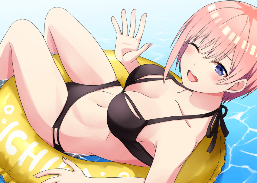 1girl ;d bare_shoulders bikini black_bikini blue_eyes blush breasts cleavage collarbone commentary_request go-toubun_no_hanayome hair_between_eyes hand_up highres innertube kamelie large_breasts looking_at_viewer midriff nakano_ichika navel one_eye_closed open_mouth pink_hair short_hair sidelocks sitting smile solo swimsuit water