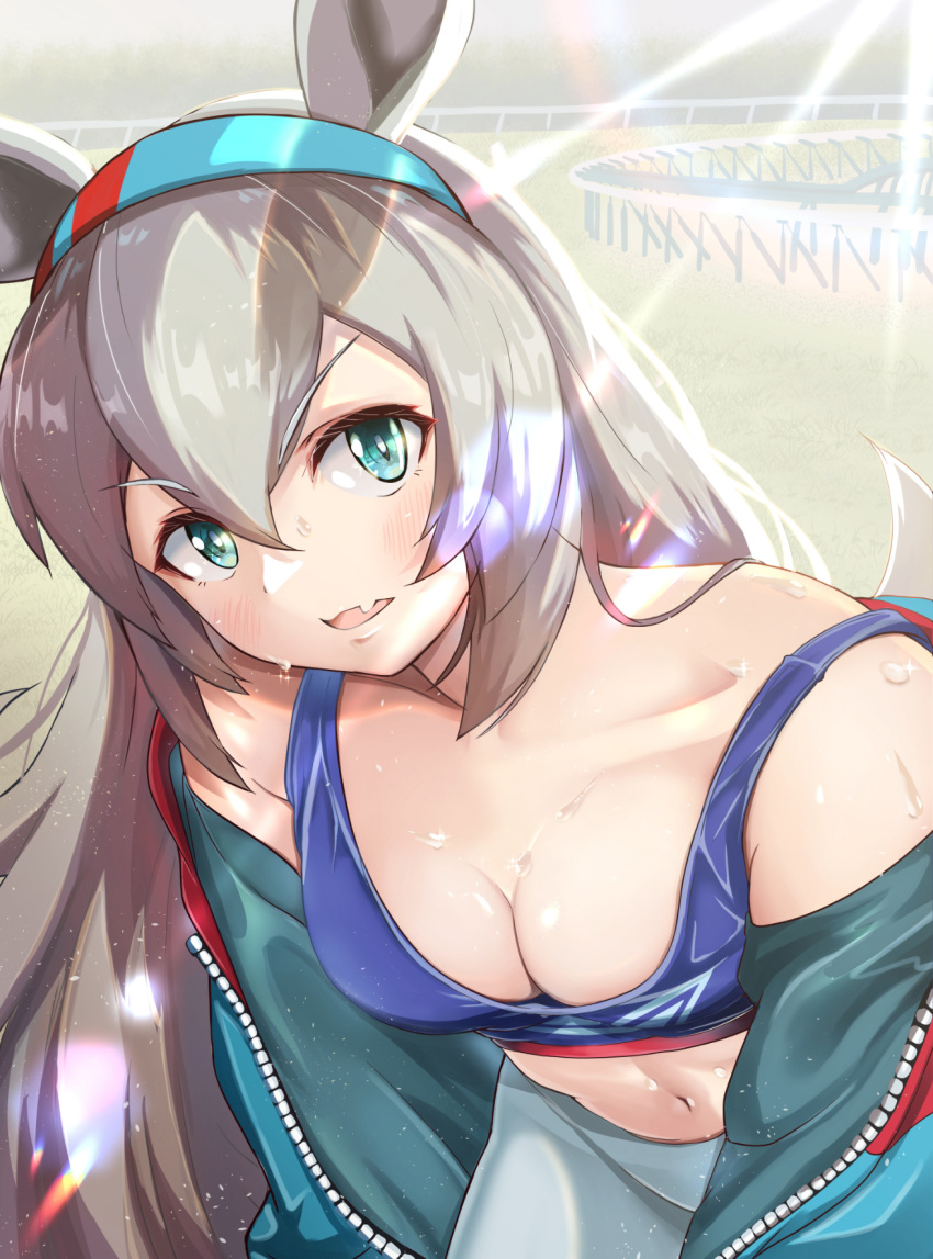 1girl animal_ears aqua_hairband bare_shoulders blue_eyes blue_jacket blue_sports_bra breasts cleavage commentary_request fang grey_hair hair_between_eyes hairband highres horse_ears horse_girl jacket jacket_partially_removed leaning_forward lens_flare long_hair looking_at_viewer mashiroshiro midriff navel open_clothes open_jacket open_mouth outdoors racetrack skin_fang small_breasts solo sports_bra strap_slip tamamo_cross_(umamusume) umamusume