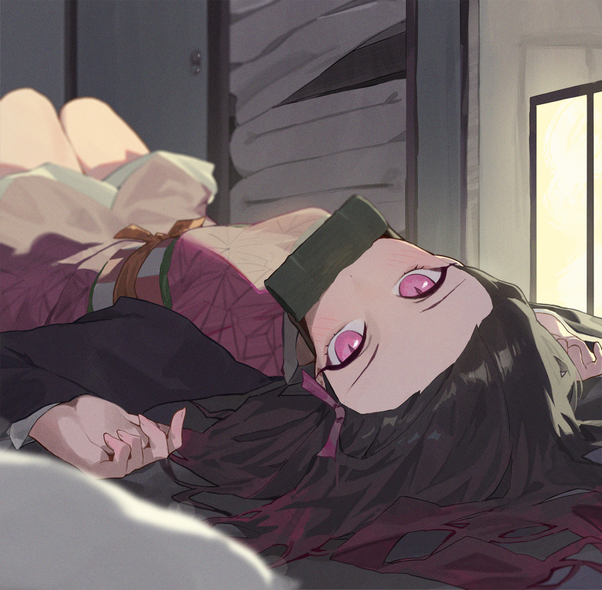 1girl asa_no_ha_(pattern) bamboo bit_gag black_hair blush checkered_sash commentary_request forehead gag gagged gradient_hair hair_ribbon highres japanese_clothes kamado_nezuko kimetsu_no_yaiba kimono kji_(rozo) long_hair long_sleeves looking_at_viewer lying multicolored_hair obi on_back pillow pink_eyes pink_kimono pink_ribbon ribbon sash solo very_long_hair