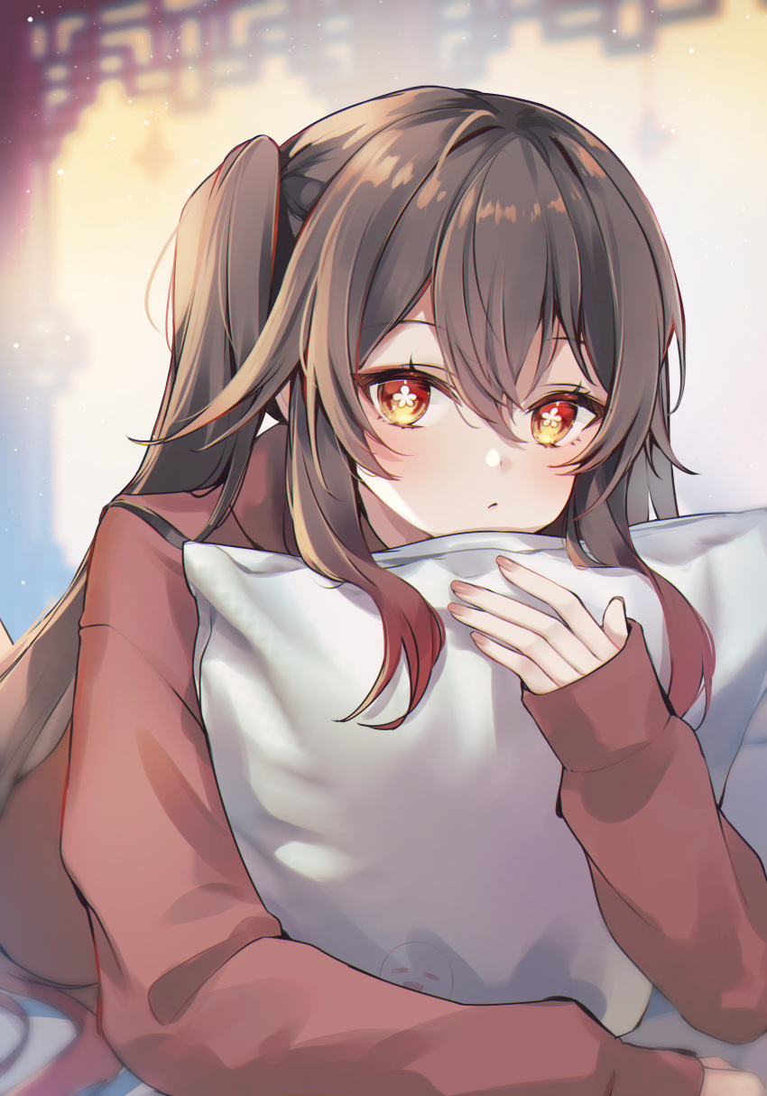 1girl 7aka_ne11 absurdres boo_tao_(genshin_impact) brown_hair closed_mouth colored_tips commentary flower-shaped_pupils genshin_impact highres holding holding_pillow hu_tao_(genshin_impact) long_hair long_sleeves looking_at_viewer multicolored_hair on_bed pillow red_eyes red_hair red_shirt shirt solo symbol-shaped_pupils twintails upper_body