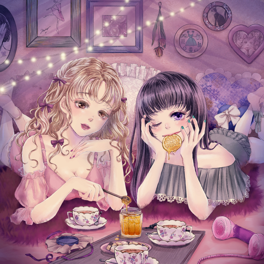 2girls aqua_nails barefoot black_hair blonde_hair bow bra breasts brown_eyes cleavage cup flower food frilled_pillow frills fruit hair_bow heart heart_pillow highres honey legs_up lemon lemon_slice long_hair looking_at_viewer lying multiple_girls on_stomach one_eye_closed open_mouth orange_flower original phone pillow pink_bra plate purple_bow purple_eyes red_nails smile snails0106 underwear white_bow