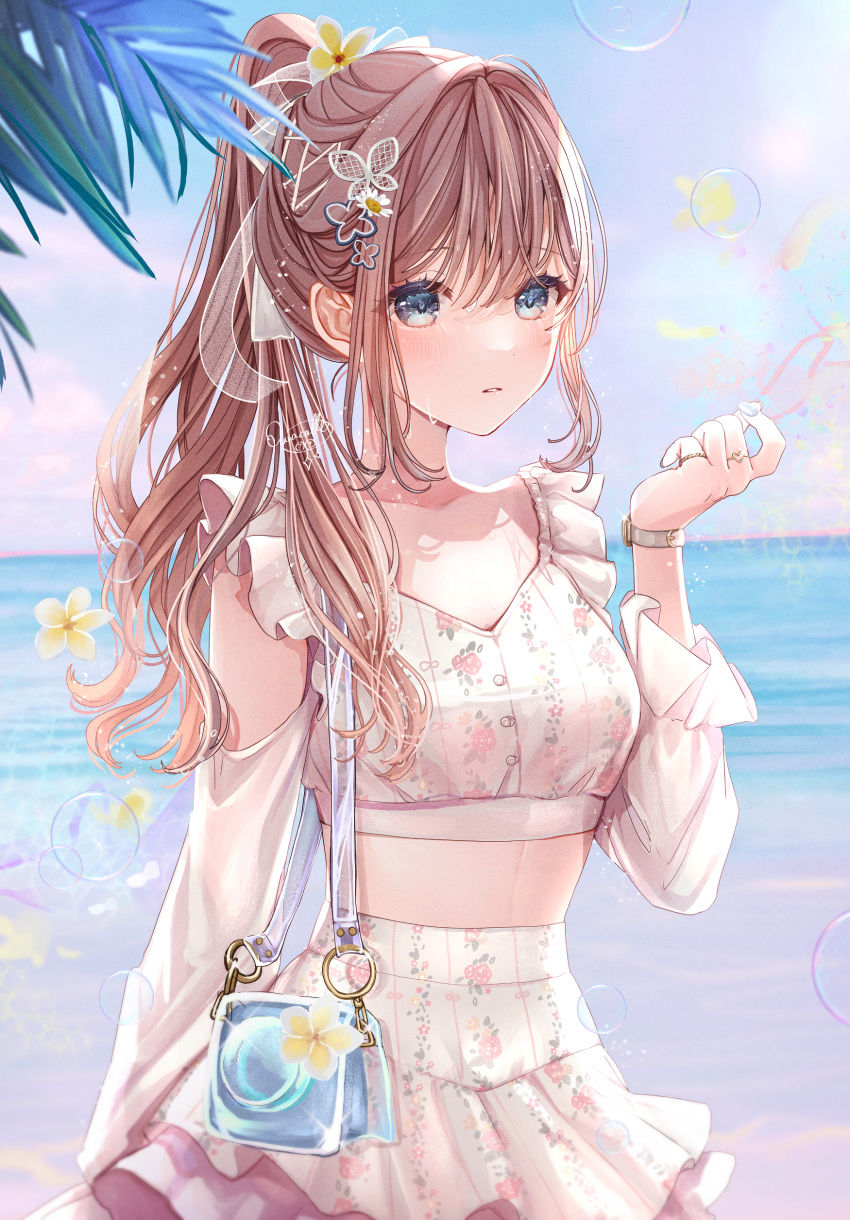 1girl absurdres bag blue_sky breasts brown_hair butterfly_hair_ornament collarbone commentary_request crop_top day floral_print flower grey_eyes hair_between_eyes hair_ornament hand_up high_ponytail highres horizon long_sleeves looking_at_viewer midriff original outdoors ponytail print_shirt print_skirt puffy_long_sleeves puffy_sleeves puracotte shirt shoulder_bag skirt sky small_breasts solo watch water white_shirt white_skirt wristwatch yellow_flower