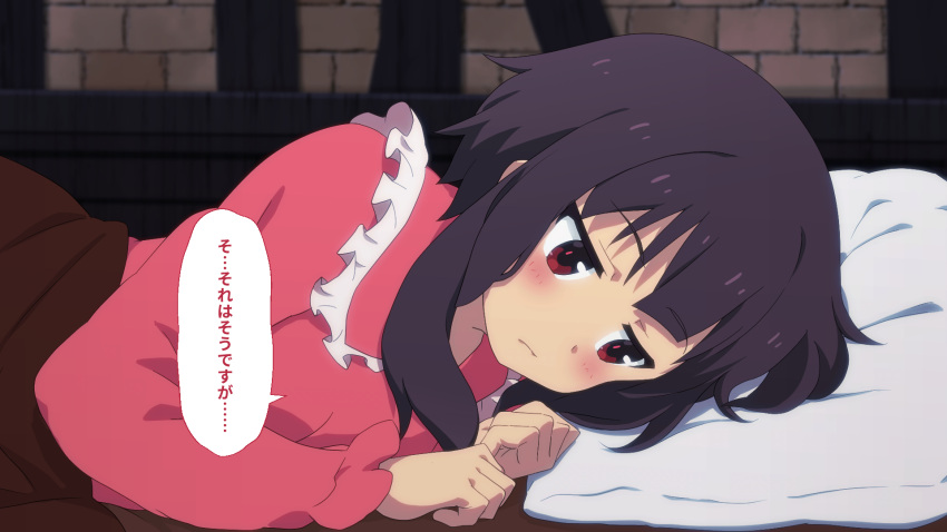 1girl black_hair blush clenched_hands closed_mouth collar commentary_request frilled_collar frilled_sleeves frills frown hair_between_eyes head_on_pillow highres indoors kono_subarashii_sekai_ni_shukufuku_wo! long_sleeves looking_away lying megumin no_headwear on_side paid_reward_available pajamas pink_pajamas red_eyes short_hair_with_long_locks shy solo speech_bubble toraya_(doujintraya) under_covers upper_body